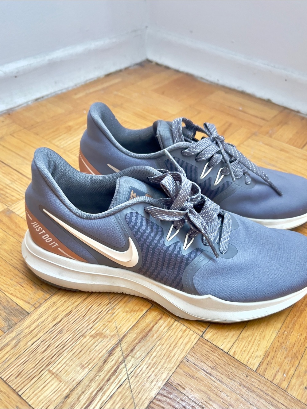 Nike Gray Sneakers with Peach Accent and White Swoosh